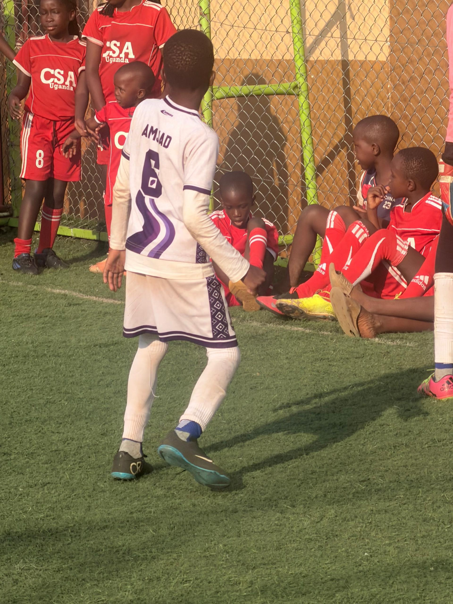 Academy player number 6 preparing on the touchline during a competitive fixture
